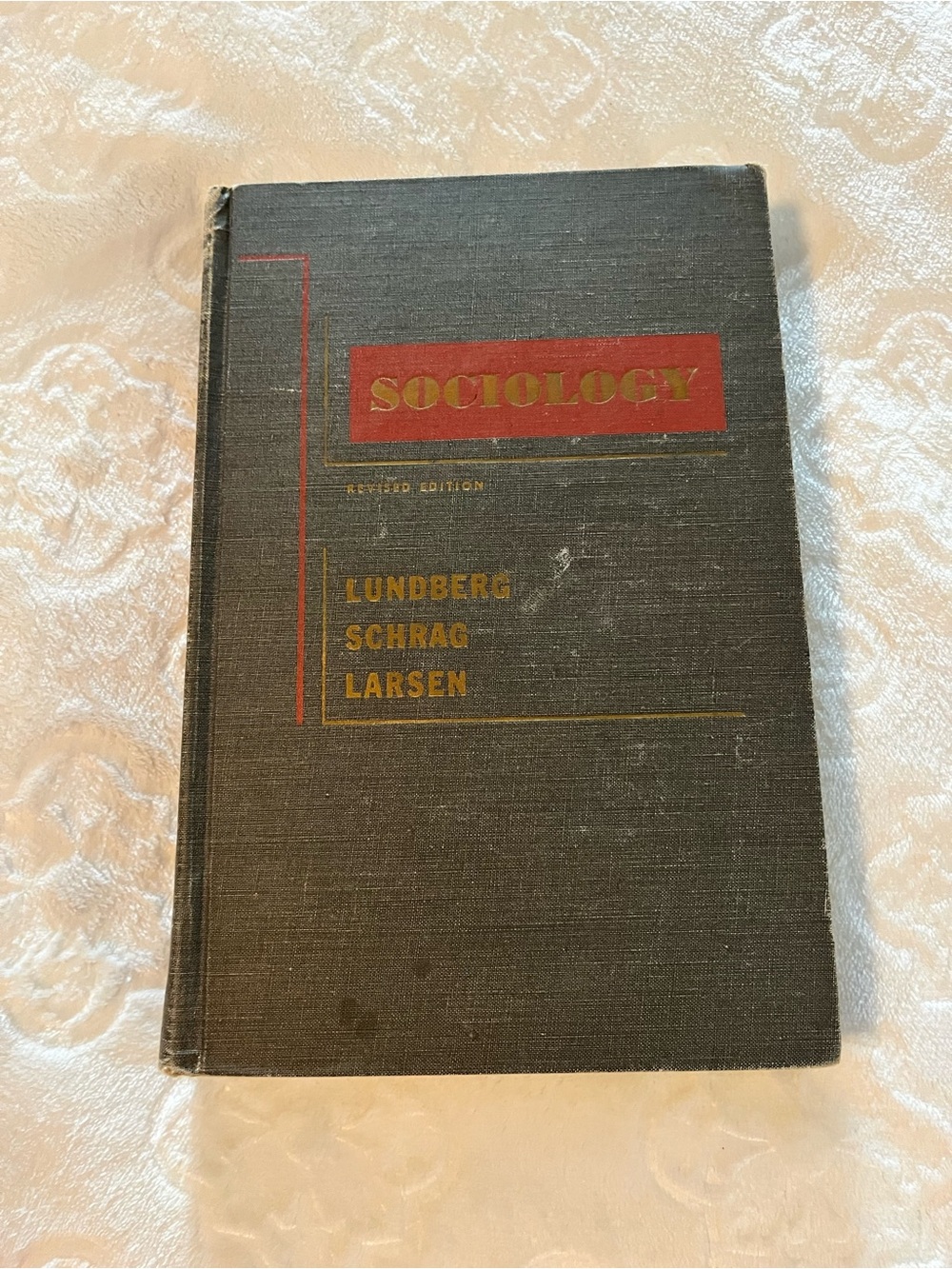 Harper Black Hardcover Book with Red and Gold Accents